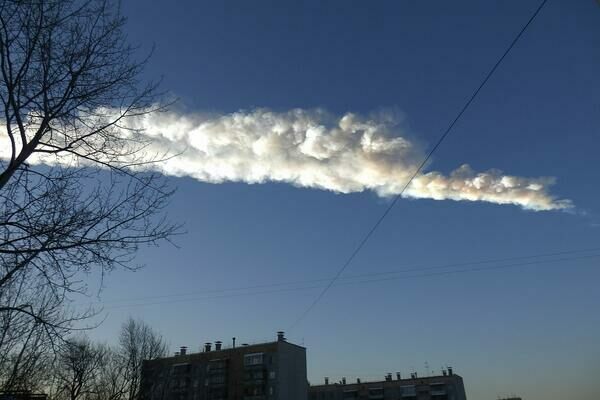 The Chelyabinsk meteorite streaks across the sky in Russia.